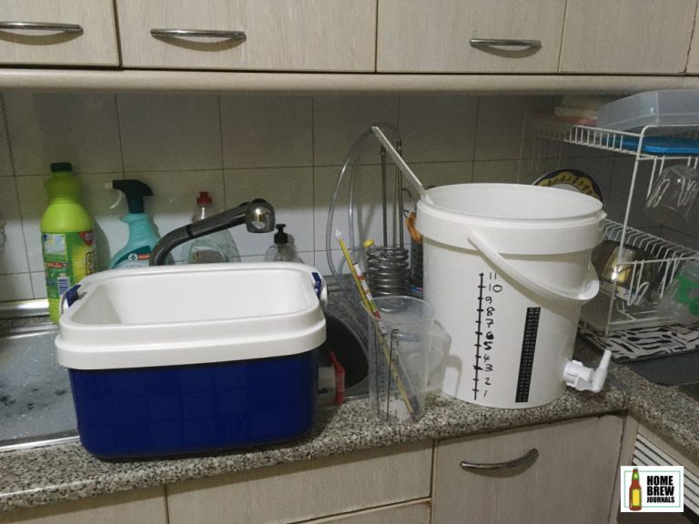 Part of my small-batch, all-grain homebrew equipment: a 10l mash tun, fermentation bucket and cooling coil next to the kitchen sink.