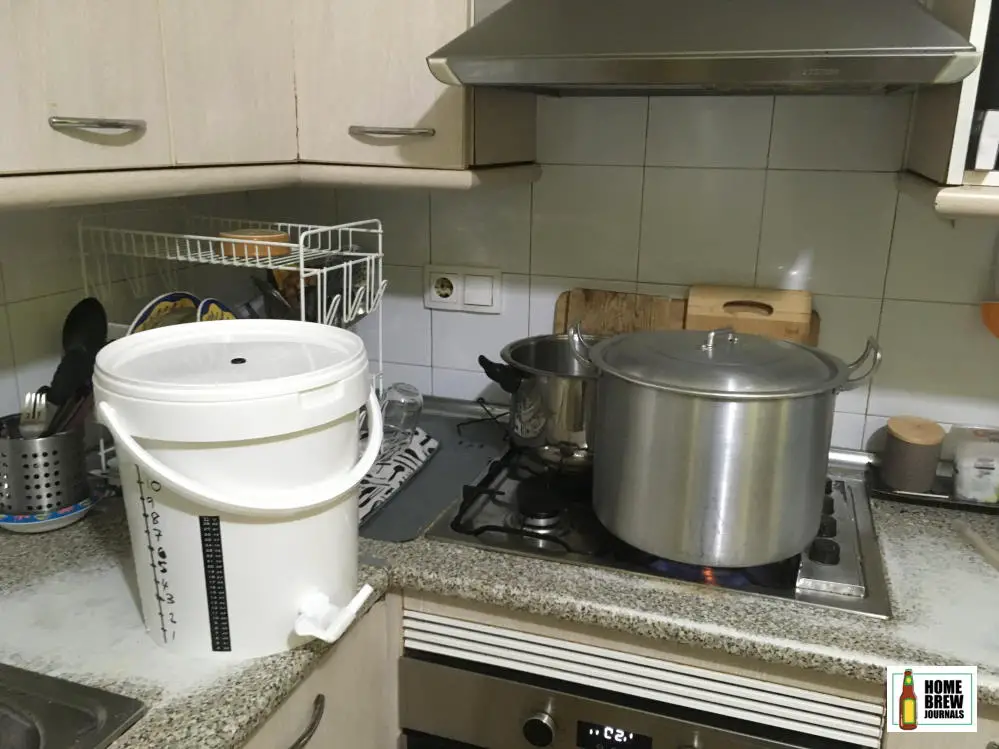 Stovetop craft beer brewing setup, stock pot brew kettle and plastic fermenting bucket