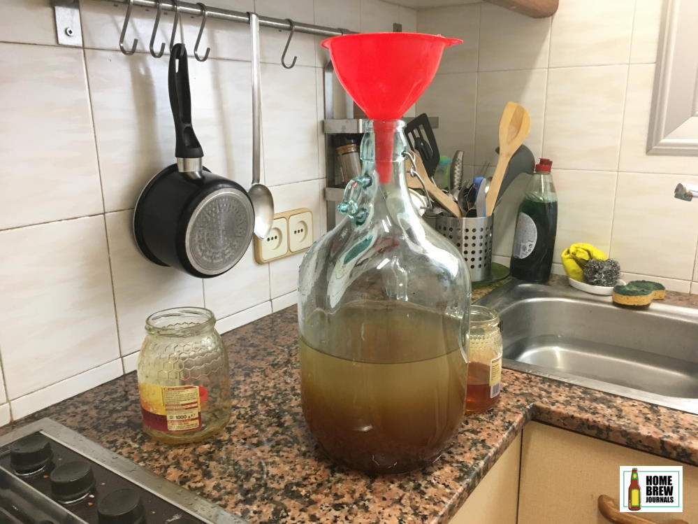 Photo of honey and water in a demijohn, illustration for how to make Viking mead homebrew article