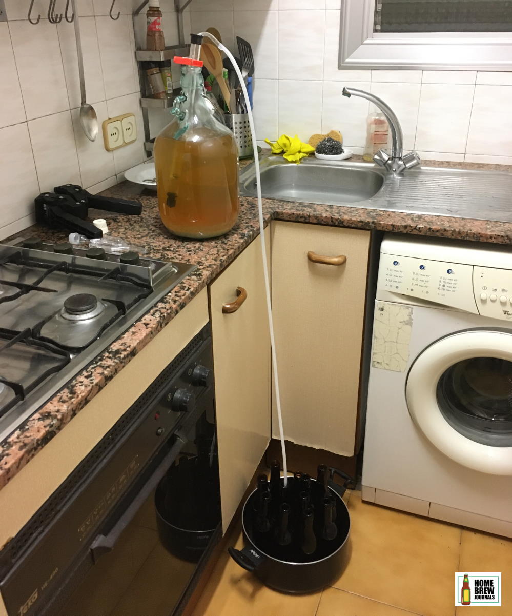 Photo of a auto-siphon being used to transfer mead from a carboy to bottles