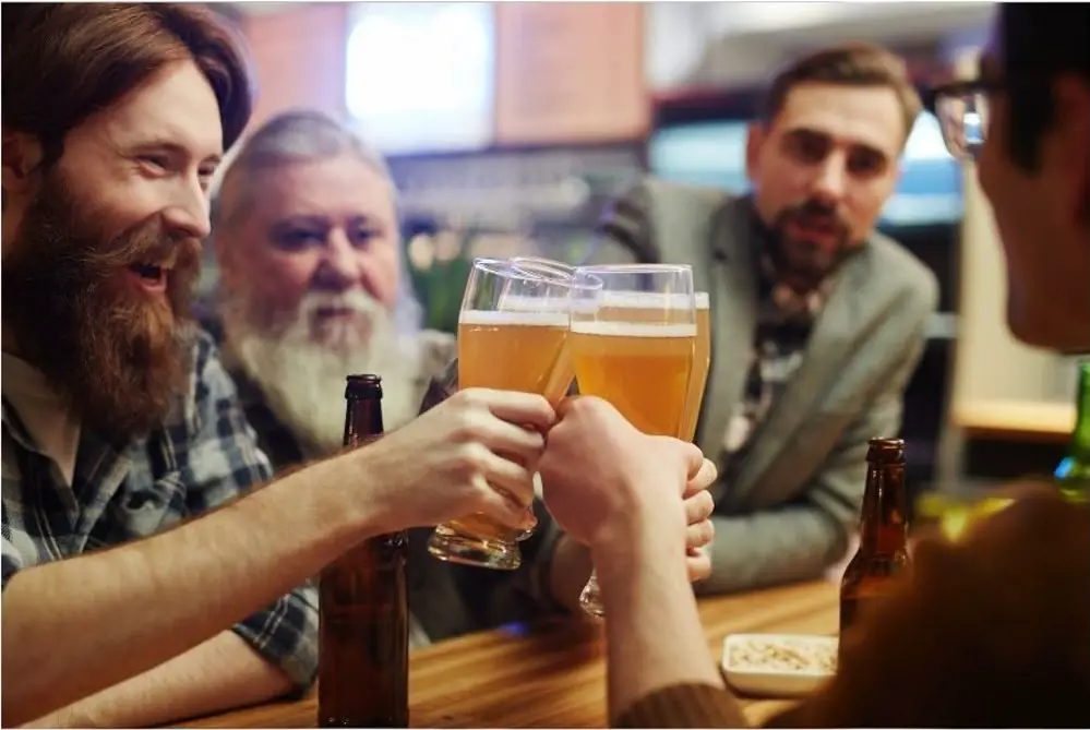 A group of friends enjoying some vegan homebrew beer